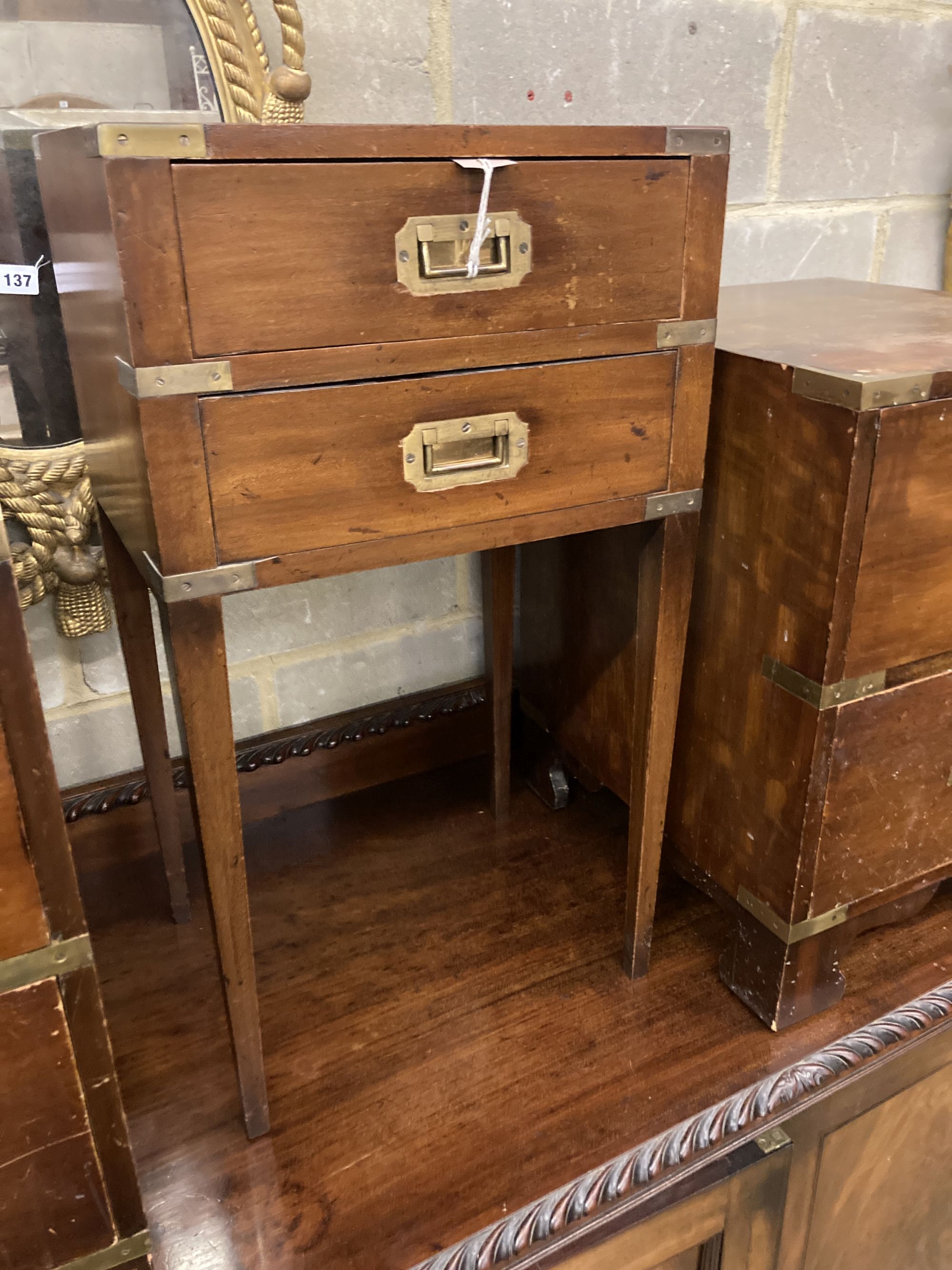 Three military style mahogany two drawer bedside chests, larger width 40cm, depth 46cm, height 56cm